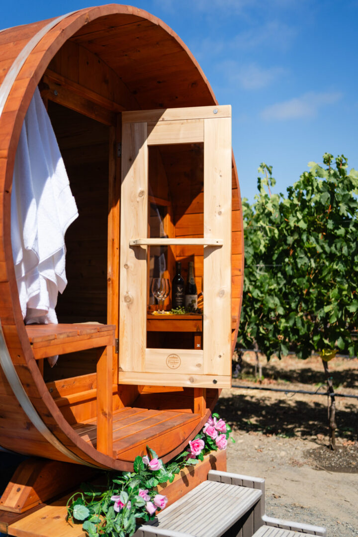 A wooden barrel with a window and door.