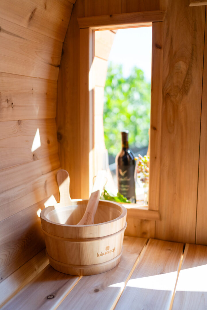 A bucket of wood and some wine bottles